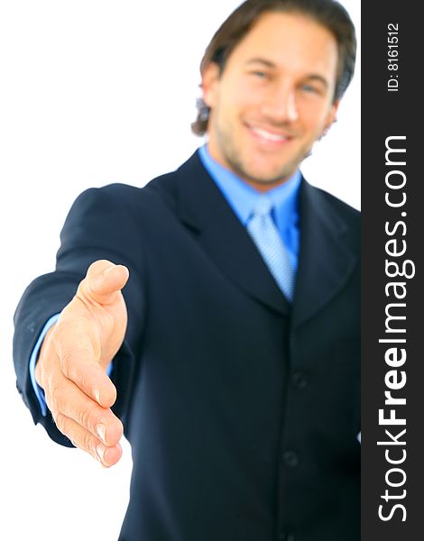 Caucasian businessman offering hand shake with smile. focus on the hand. Caucasian businessman offering hand shake with smile. focus on the hand