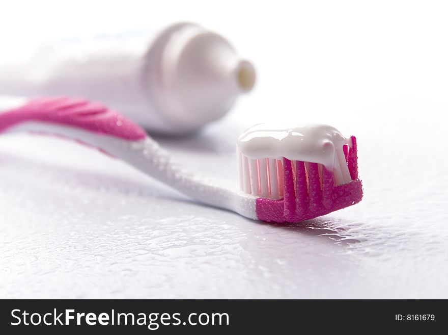 Toothpaste and toothbrush on white. dental care