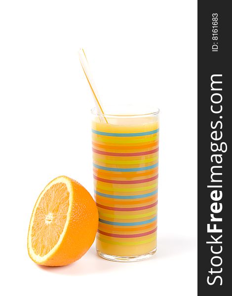 Half of orange and juice in glass on white