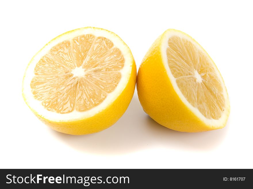 Fresh lemon halves on white background
