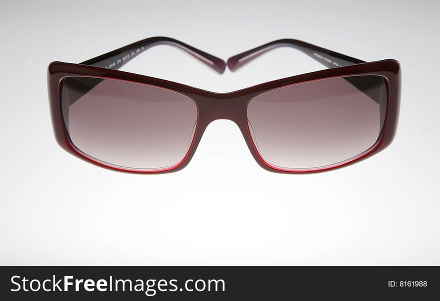 Purple sunglasses isolated on white background