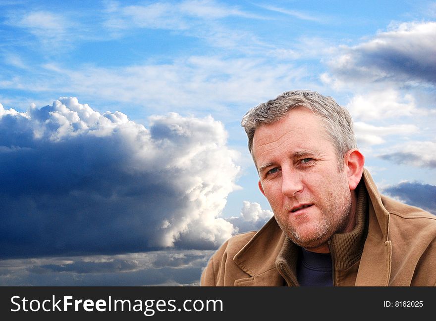 Man against a lovely stormy sky background. Man against a lovely stormy sky background