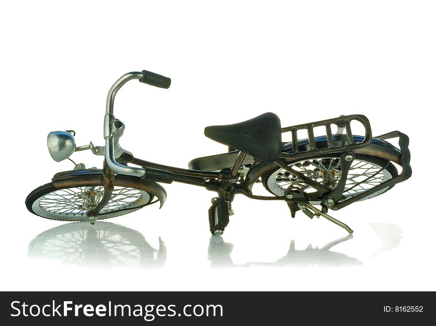 A toy bicycle is isolated on a white background