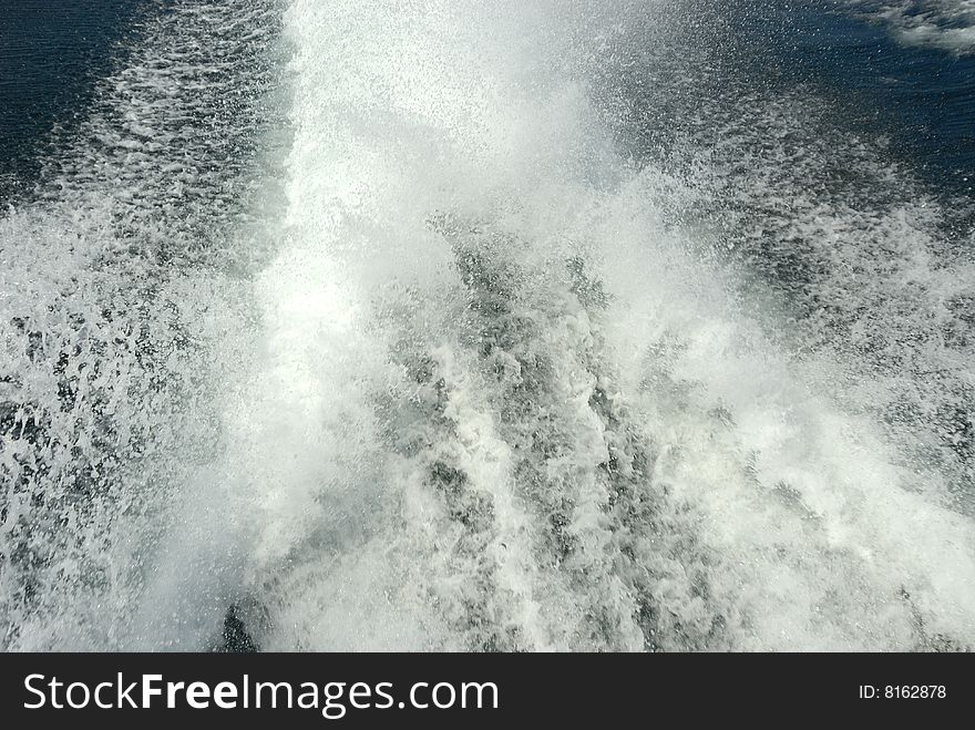 The wake from a high speed boat on the water. The wake from a high speed boat on the water