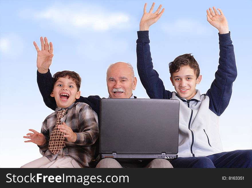 Boy playing on the computer while grandfather teaching it. Boy playing on the computer while grandfather teaching it