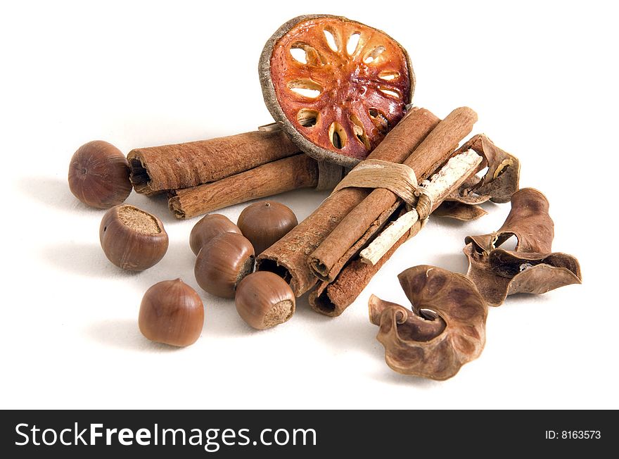 Dried fruit cinnamon and nuts isoated on white background. Dried fruit cinnamon and nuts isoated on white background