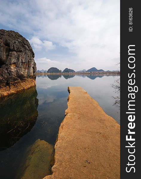 The brown color flagstone, extends to the blue color lake center