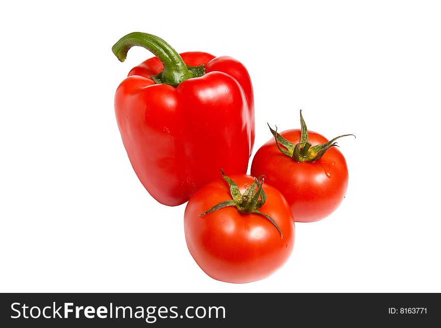Raw fresh pepper and two tomatoes isolated on a white background. Raw fresh pepper and two tomatoes isolated on a white background.