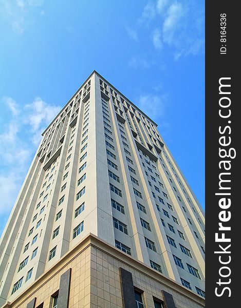 Modern office building against blue sky