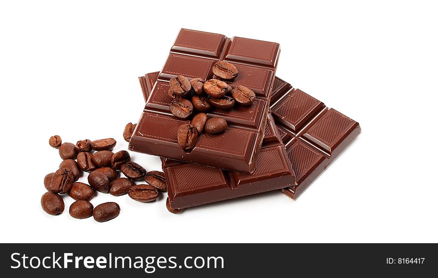 Block of chocolate and coffe seeds