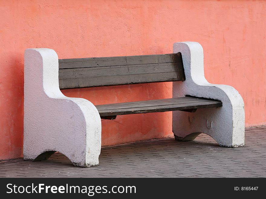 Bench with concrete hand-rail