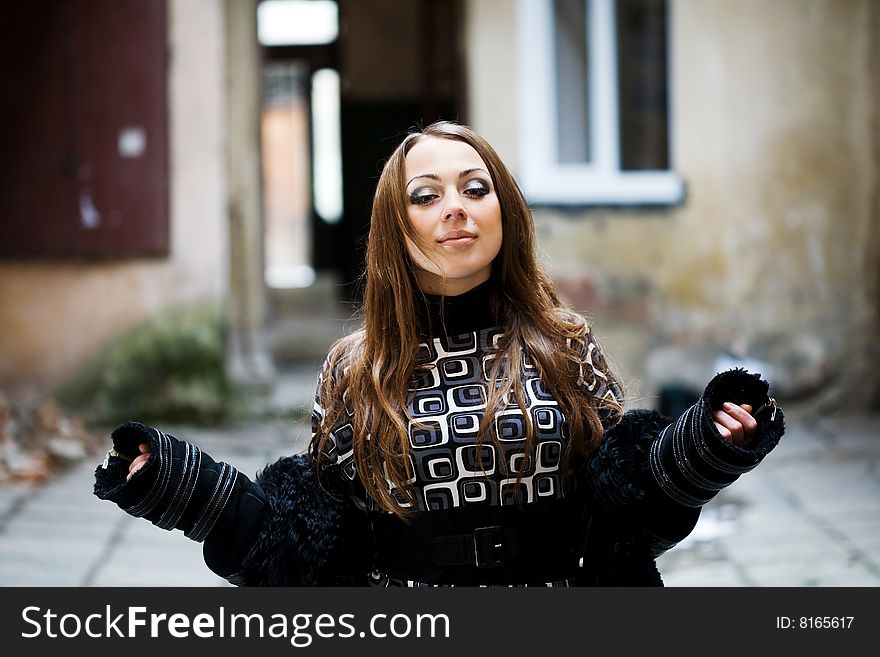 Stock photo: an image of a woman standing in the yard. Stock photo: an image of a woman standing in the yard