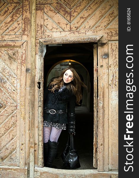 Stock photo: an image of a woman standing in the doorway