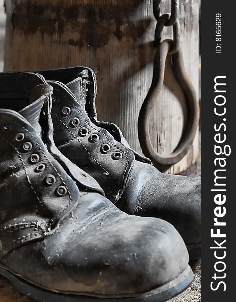 Stock photo: an image of old black dirty boots. Stock photo: an image of old black dirty boots