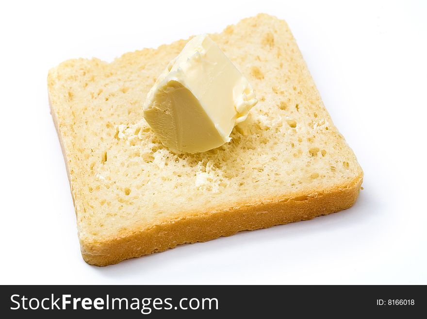 Stock photo: an image of yellow butter on a slice of bread. Stock photo: an image of yellow butter on a slice of bread