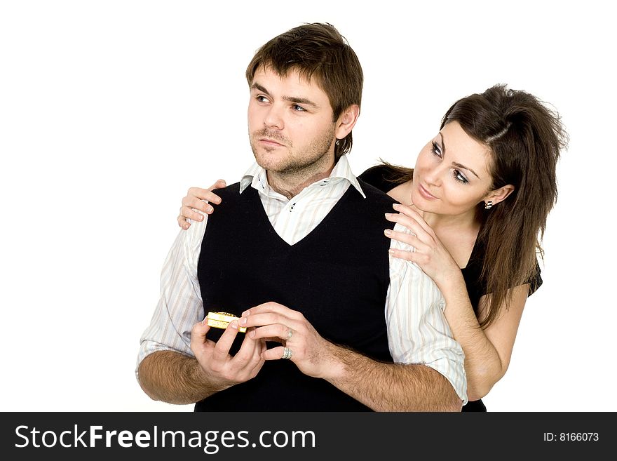 Stock photo: an image of a man with a yellow box and a woman behind him. Stock photo: an image of a man with a yellow box and a woman behind him