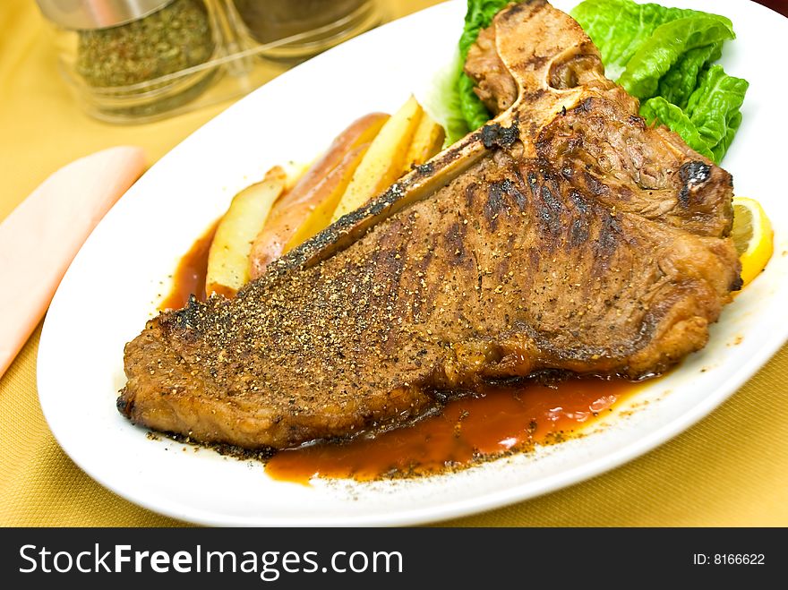 T - Bone Steak With Fresh Salad And Red Potatoes