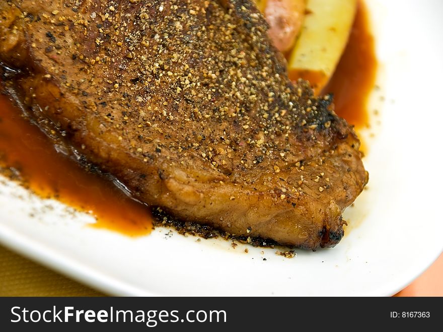 T - Bone Steak with fresh Salad and red Potatoes