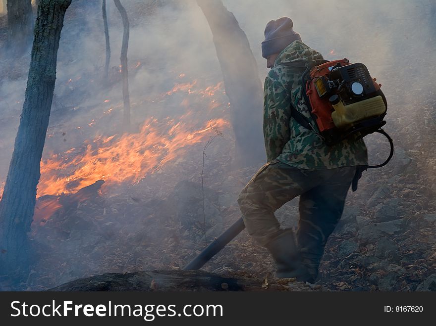 Suppression of forest fire by the inspector of protection of the state natural reserve Lazovsky. Russian Far East, Primorye. Suppression of forest fire by the inspector of protection of the state natural reserve Lazovsky. Russian Far East, Primorye.