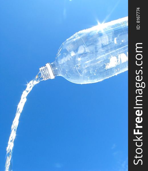 Water pouring from water bottle. Water pouring from water bottle