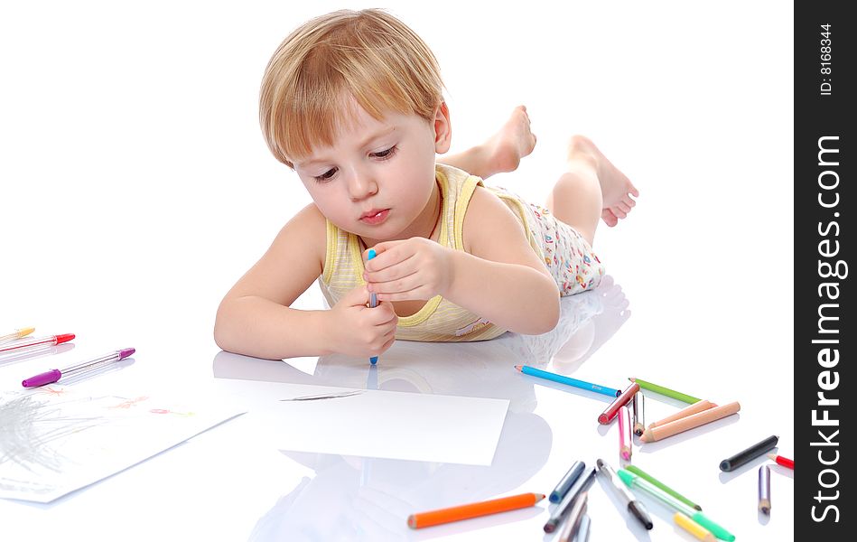 Little sweet artist at work. Isolated on a white background.