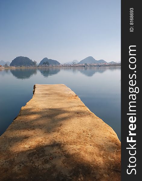 The brown color flagstone, extends to the blue color lake center