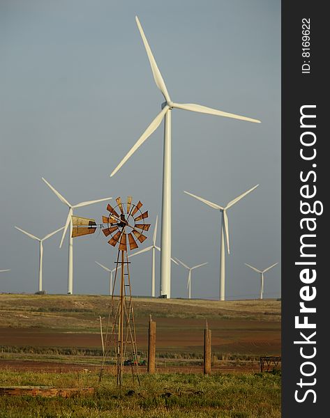 Windmill Surrounded By Wind Turbines