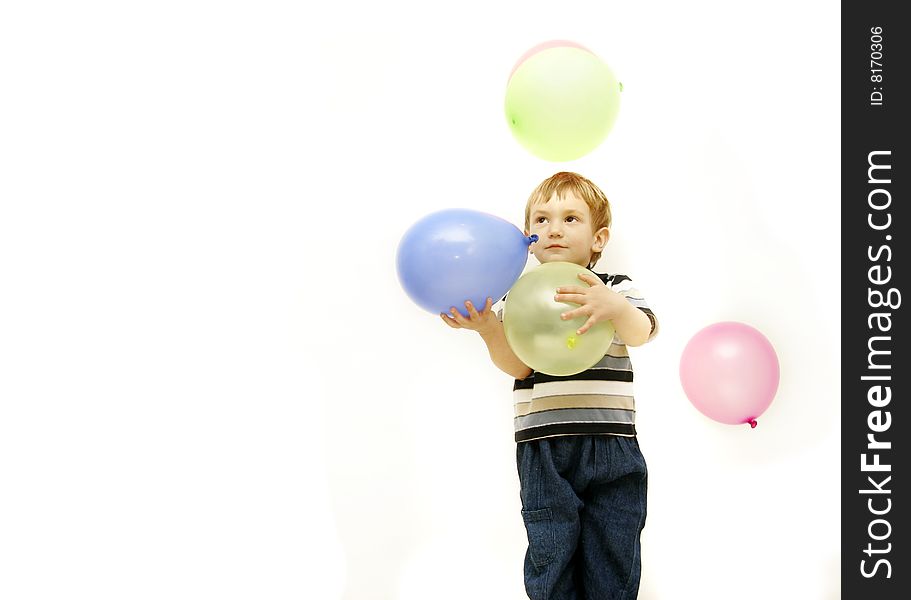 Boy with colorful balloons over white