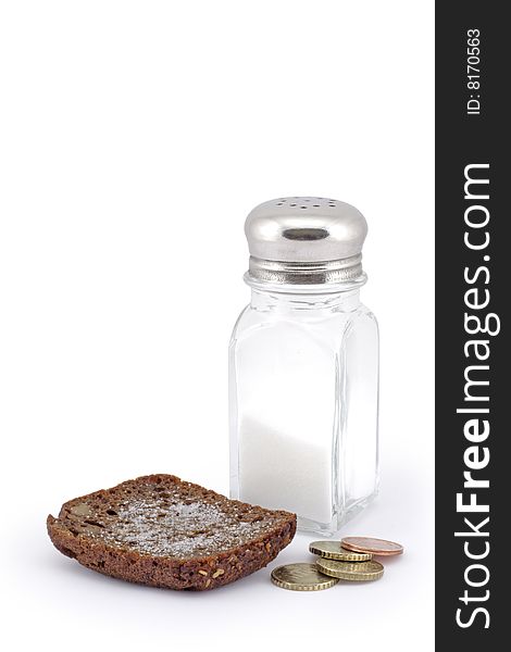 Bread with salt and coins. A white background.