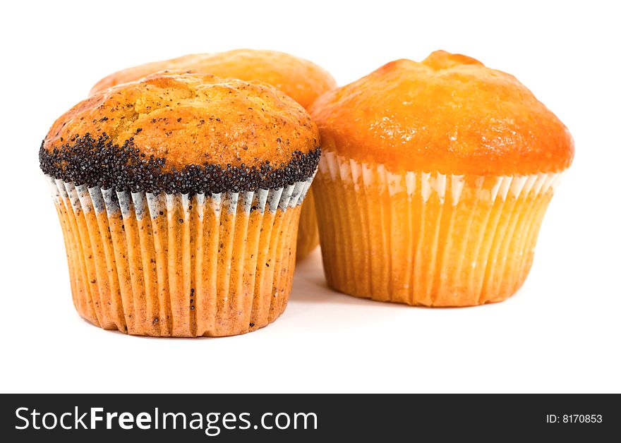 Three tasty muffins with poppies isolated on white background. Three tasty muffins with poppies isolated on white background