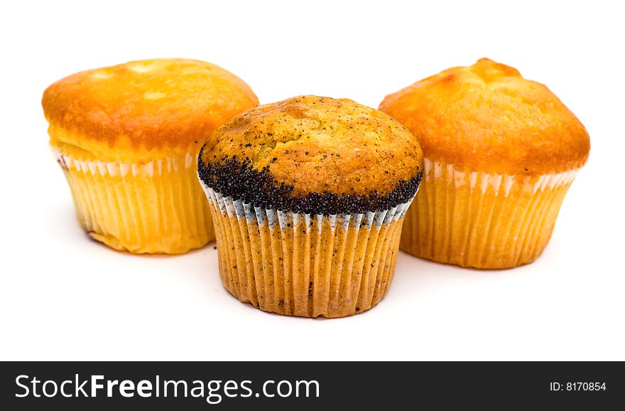 Three tasty muffins with poppies isolated on white background. Three tasty muffins with poppies isolated on white background