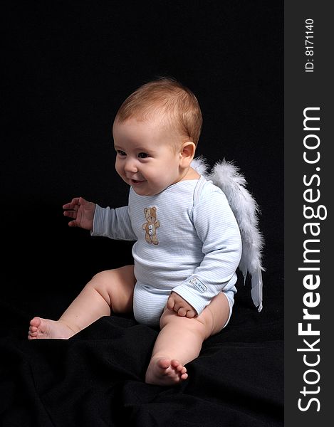 Little Angel over black background