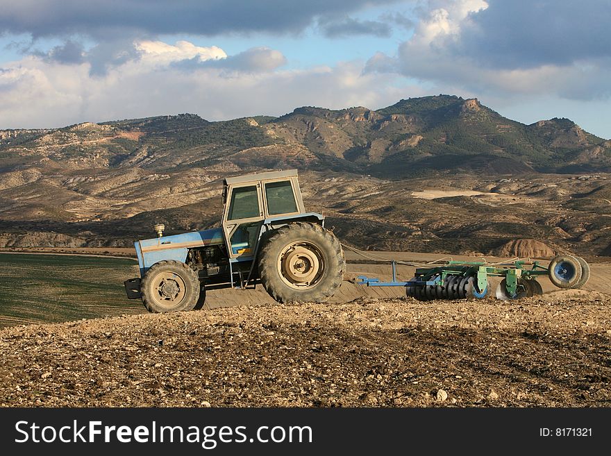Tractor plowing extremely dry land (Spain)