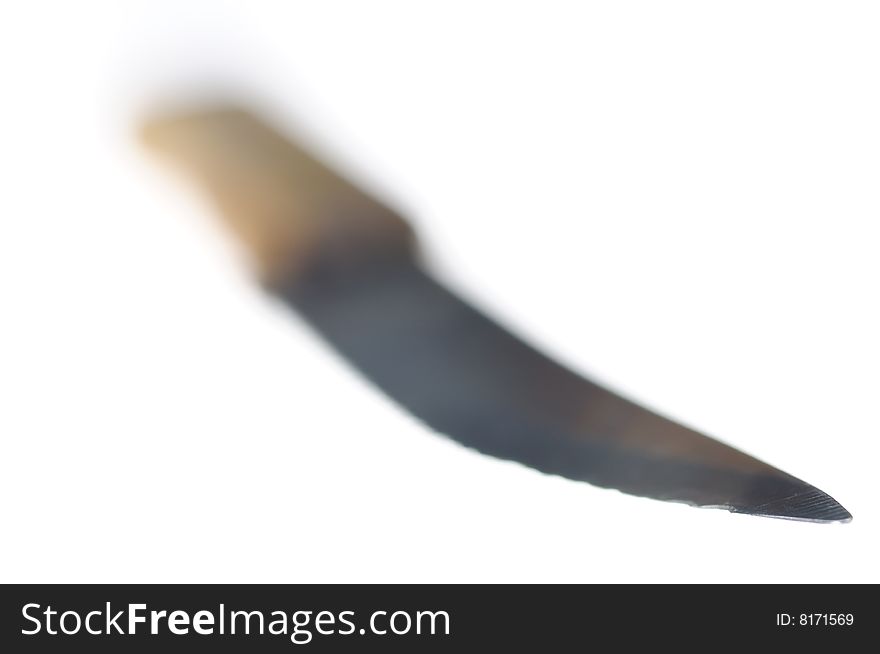 Small kitchen knife with wooden handle isolated on the white. Old and used. Narrow depth of field. Small kitchen knife with wooden handle isolated on the white. Old and used. Narrow depth of field.