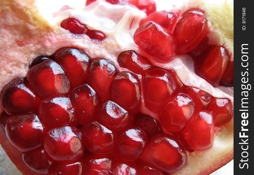 Red juicy pulp of pomegranate