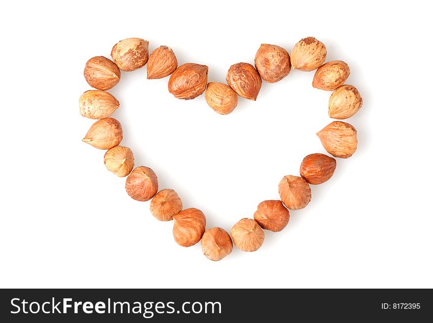 Heart made with nuts on white background