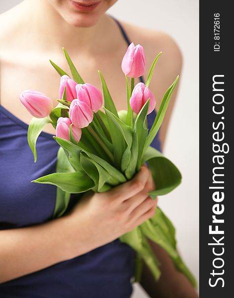 Beautiful hands holding tulips. Soft-focused. Beautiful hands holding tulips. Soft-focused.