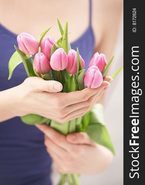 Beautiful hands holding tulips. Soft-focused. Beautiful hands holding tulips. Soft-focused.