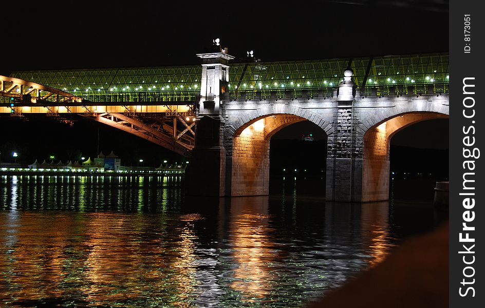 Drawbridge in St. Petersburg, river Neva, white nights, night cityscape