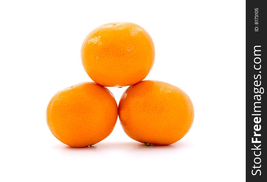Three oranges tangerines clementines in a pile