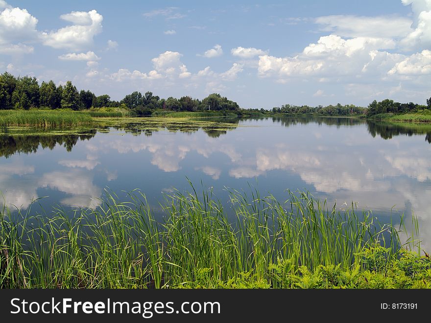 Summer river  view with blue sky and clouds. Summer river  view with blue sky and clouds.