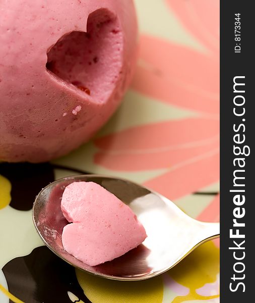 Delicious sweet pink dessert and spoon. Delicious sweet pink dessert and spoon