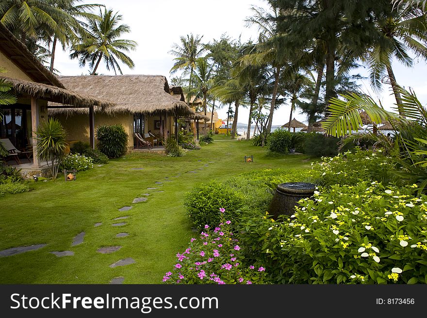 Bungalows of tropical beach resort at sunny day