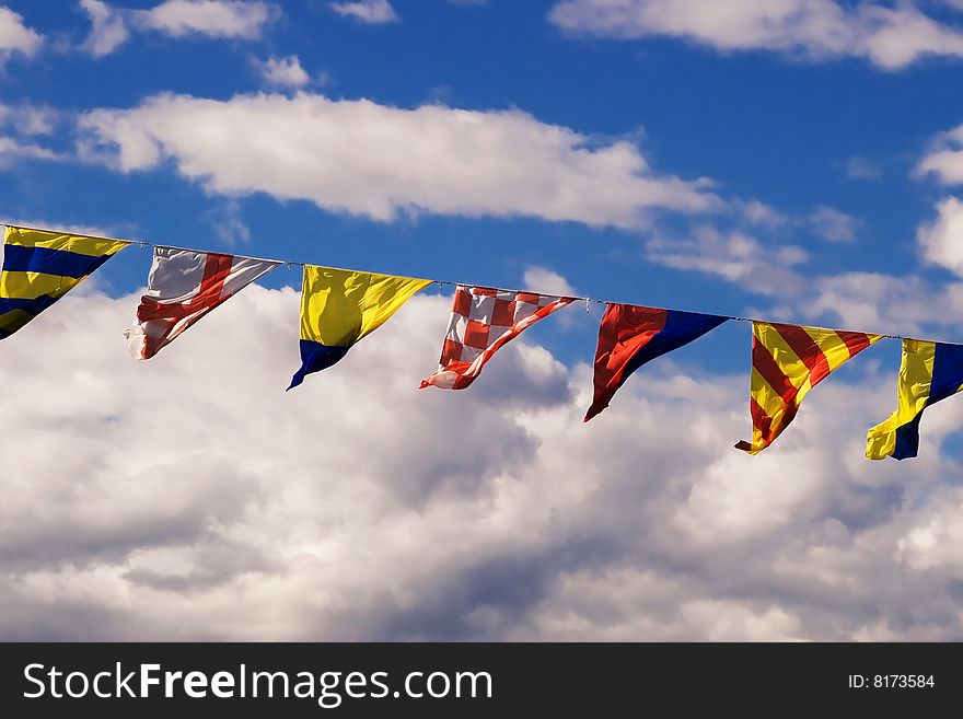 Naval flags on a cloudy sky background