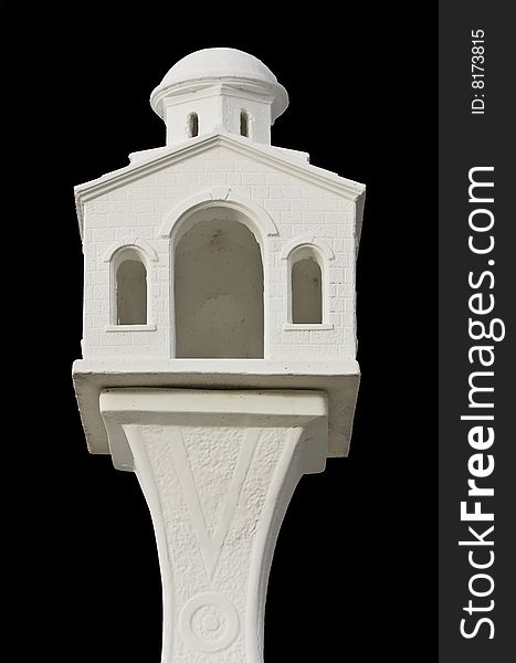 Replica of a church fixed on a post made from marble. Replica of a church fixed on a post made from marble