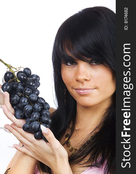 Young long hair brunette with bunch of black grapes. Young long hair brunette with bunch of black grapes