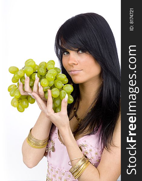 Young long hair brunette with bunch of green grapes. Young long hair brunette with bunch of green grapes