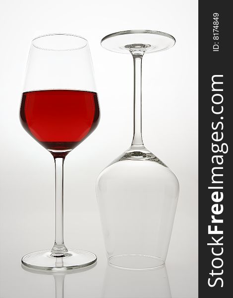 Glasses of red wine over white background. Glasses of red wine over white background