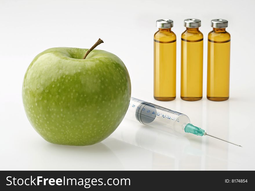 Array of medical apple, drugs and syringe. Array of medical apple, drugs and syringe