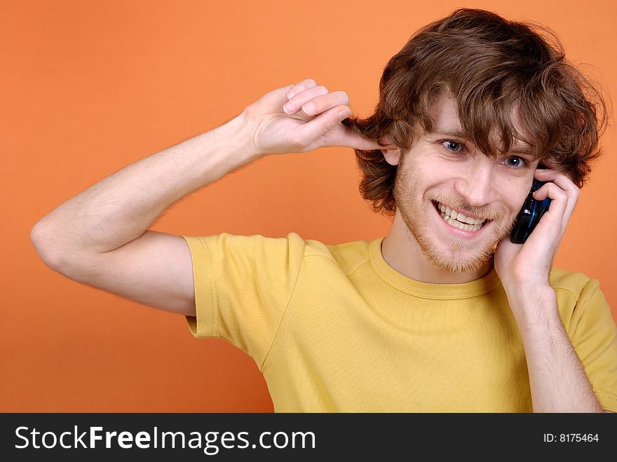 The emotional funny man speaking by phone. The emotional funny man speaking by phone